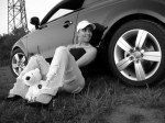 Audi-TT-8N-MK1-black-and-white-woman-sitting-next-to-car